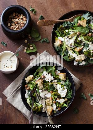 Salad with grilled broccoli, cauliflower, spinach, cabbage, garlic, dukkah and a yoghurt dip Stock Photo