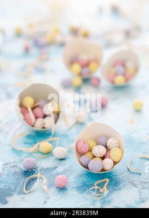 Chocolate mini eggs in egg shells Stock Photo