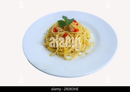 aglio e olio. Italian Pasta Spaghetti, aglio olio e pepperoni ,spaghetti with garlics, olive oil and chilli peppers on plate on table Stock Photo