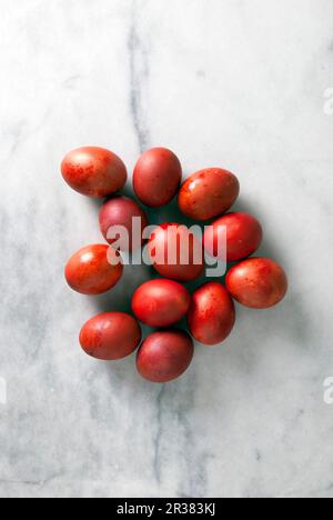 Red Greek Easter eggs on a marble background Stock Photo