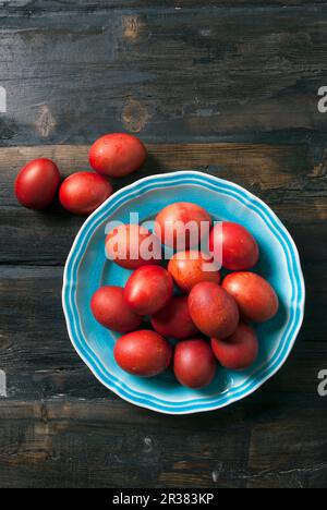 Red Greek Easter eggs on a plate Stock Photo