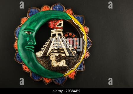 Mexican Mayan Chichen Itza ceramic painted plate isolated on black Stock Photo