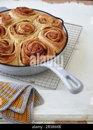 Danish cinnamon rolls in an enamel pan Stock Photo