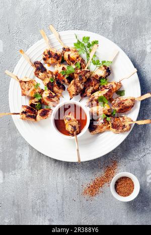 Spicy chicken kebabs with a dip Stock Photo