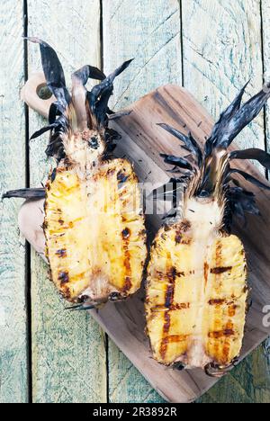 Grilled pineapple sliced in half Stock Photo