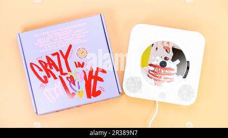 K-pop group Itzy CRAZY IN LOVE 1st Album on yellow background. Special edition music CD. South Korean girl group Itzy. Space for text. Gatineau, QC Ca Stock Photo