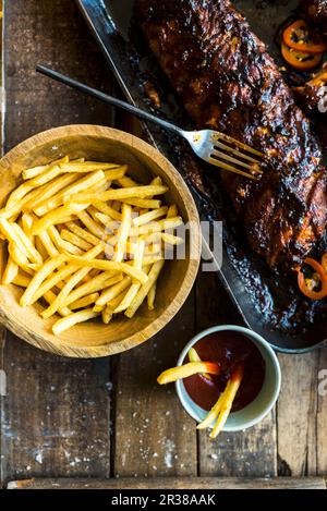 Pork ribs and french fries Stock Photo