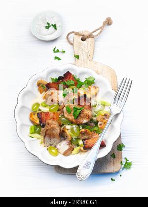 Pork fillet with mushrooms and grapes (traditional wine-growing region dish) Stock Photo