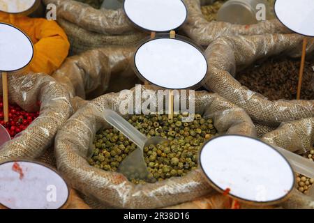Close up bags of spices with blank price tags Stock Photo