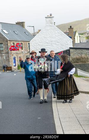 Norwegian day being celebrated in the Shetland village of Scalloway at the Shetland Bus memorial in the village on the westside of the islands. Stock Photo