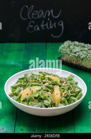 Lamb's lettuce with orange filets and pine nuts Stock Photo