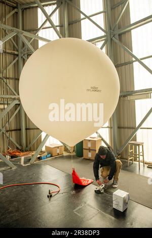 Weather balloon being released from Lerwick Met Station on the Shetland Isles off Scotland. Stock Photo