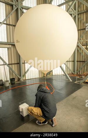 Weather balloon being released from Lerwick Met Station on the Shetland Isles off Scotland. Stock Photo