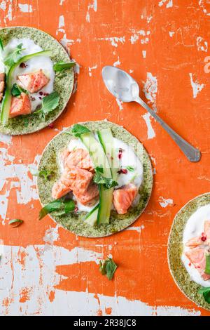 Algae tacos with salmon and cucumber strips Stock Photo