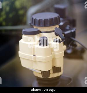 Army binoculars with night vision on a soldier's helmet. Optical device on a military helmet for tracking in war Stock Photo