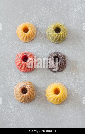 Various mini gugelhupfs with powdered sugar Stock Photo