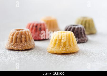 Various mini gugelhupfs with powdered sugar Stock Photo