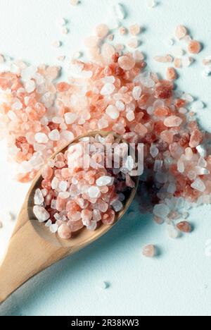 Himalayan pink salt on wooden spoon Stock Photo