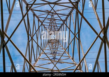 High voltage pole from below Stock Photo