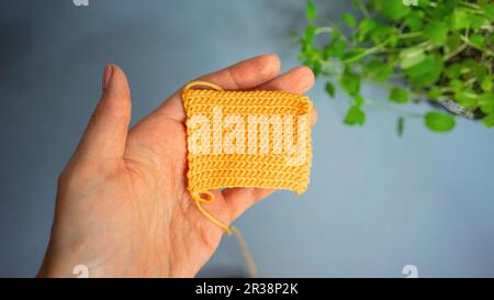 Crochet knit pattern, hands of the master Stock Photo