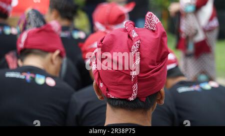 Man with Blangkon. Blangkon is a traditional head covering or hat from Java Indonesia which is worn by men. Blangkon is made of Batik cloth Stock Photo