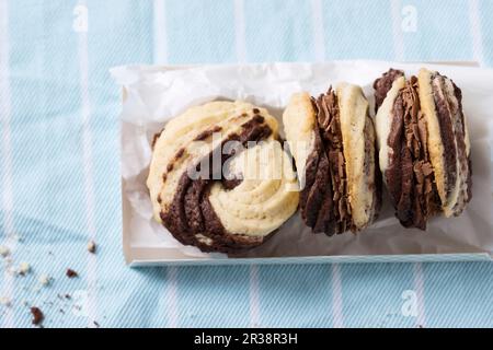 Black and white spritz cookies, filled with espresso cream (vegan) Stock Photo