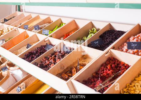 Assortment of multicolored dried fruits in the boxes Stock Photo