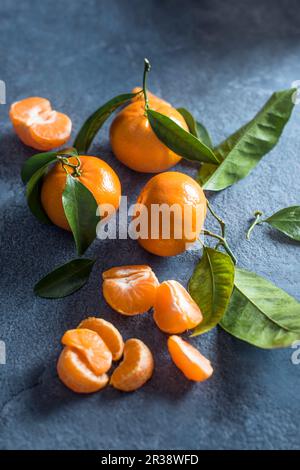 Mandarins on a stone surface Stock Photo