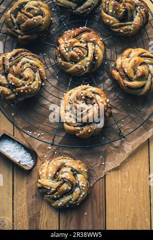 Norwegian cinnamon buns on a wire rack Stock Photo