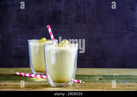 Matcha latte with straws in glasses Stock Photo