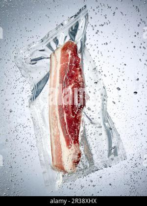 Pork belly in a sous vide bag Stock Photo