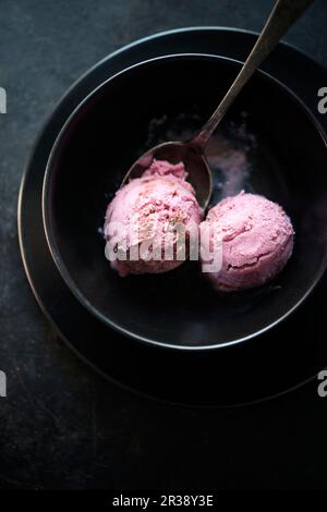 Vegan strawberry ice cream with a chocolate ripple Stock Photo
