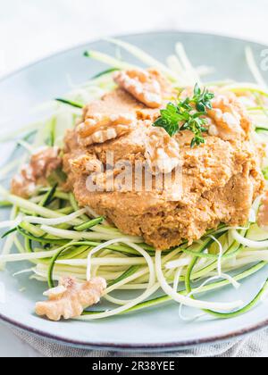 Zucchini noodles with griled pumpkin pesto Stock Photo
