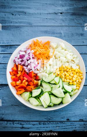 Chopped raw vegetables and sweetcorn in a bowl Stock Photo