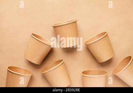 Plastic free and zero waste concept. Disposable paper cups on brown background, top view Stock Photo