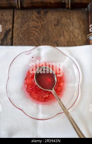 Lingon berry jam being made, setting test Stock Photo - Alamy