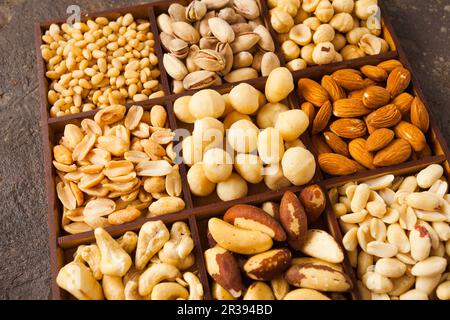 Close up variety of nuts in wooden box Stock Photo