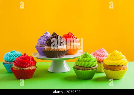 Concept of variety of choice, rainbow colour cupcakes Stock Photo