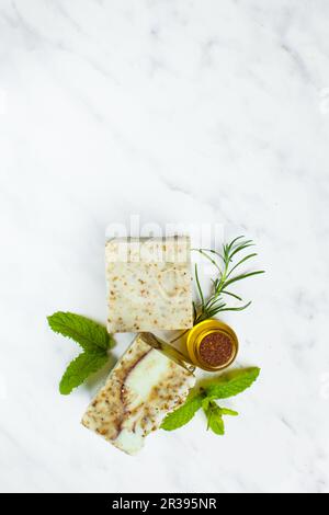 Top view of handmade organic soaps with natural herbs Stock Photo