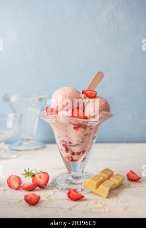 Strawberry ice cream with fresh strawberries and white chocolate Stock Photo