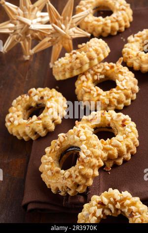 Linz wreath biscuits with chopped almonds and redcurrant jam Stock Photo