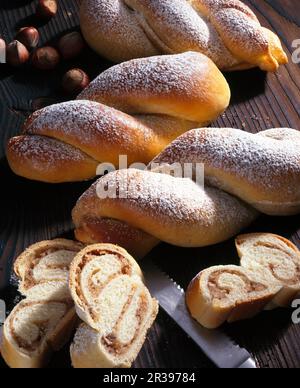 Mini yeast dough nut twists filled with marzipan Stock Photo