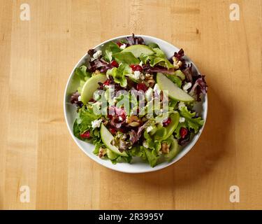 Waldorf Salad on Butcher Block Table shot from above Stock Photo