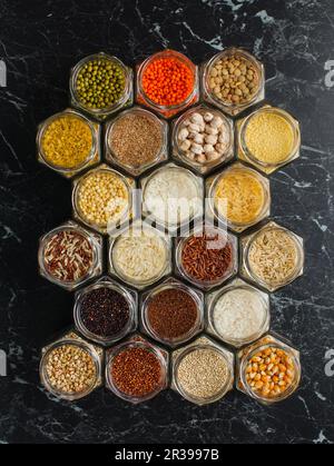 Top view of hexagon jars with cereals and beans Stock Photo