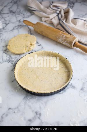 A tart base in a baking dish Stock Photo