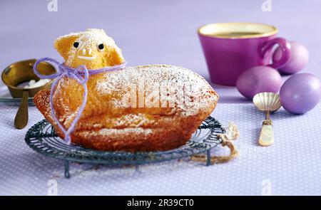 Sweet Easter lamb and purple Easter eggs Stock Photo