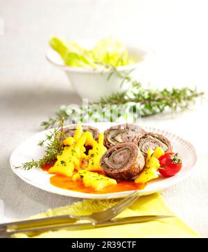 Italian beef roulade with polenta rabbits and tomato sauce Stock Photo