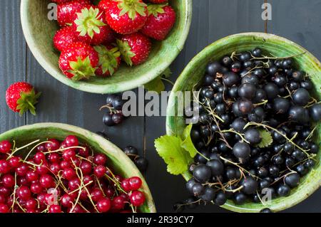 Fresh berries in ceramic bowls Stock Photo