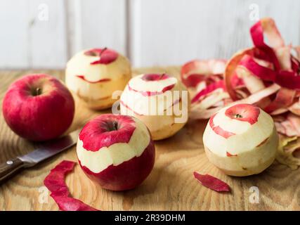Peeling red apples Stock Photo