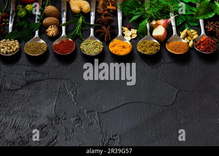 Set of spices, tableware and kitchen utensils in kitchen on table on mosaic  tiles background Stock Photo by ©belchonock 37623949